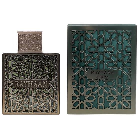 A bottle and box of Rayhaan Terra 100ml EDP by Rayhaan, both featuring intricate geometric patterns and metallic accents, capture the allure of this powerful oriental spicy fragrance.