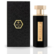 A black and gold Reef 19 100ml EDP bottle stands beside its matching textured box with a gold hexagonal label and rose pattern, showcasing this distinctive unisex fragrance from Reef.
