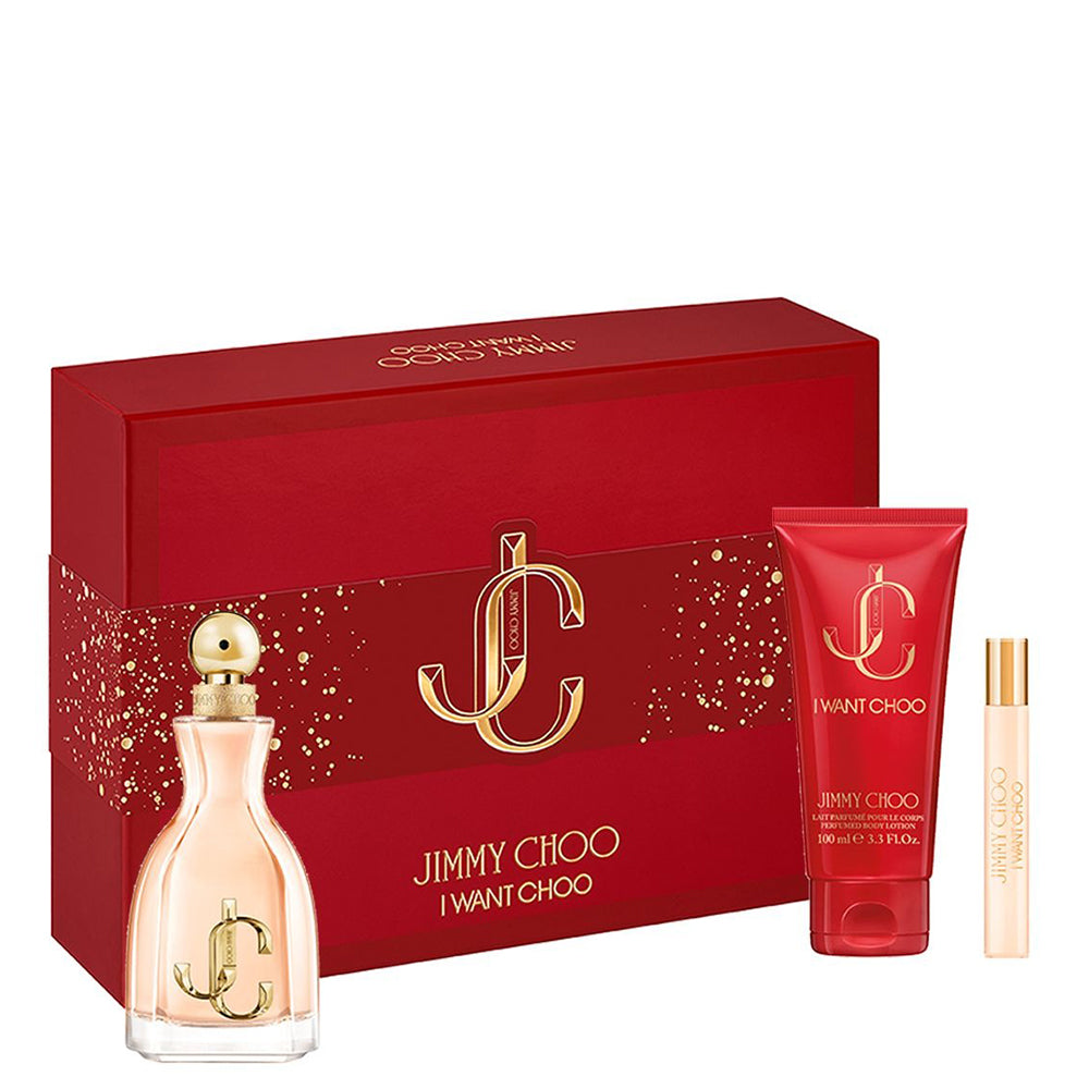 A red Jimmy Choo I Want Choo 100ml Eau De Parfum Gift Set box with an Eau De Parfum bottle, body lotion, and travel spray displayed in front.