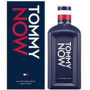 A 100ml bottle of Tommy Hilfiger Now EDT for men is displayed beside its matching box, featuring bold white and red branding that highlights the fresh, modern style of this fragrance.