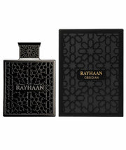 A black Rayhaan Obsidian 100ml EDP bottle featuring geometric patterns is displayed alongside its coordinating black patterned box, perfectly capturing the sophisticated allure of this woody men’s fragrance from Rayhaan.