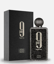 Afnan 9PM Night Out 100ml Extrait de Parfum by Afnan stands next to its sleek black box, making it an ideal evening fragrance.