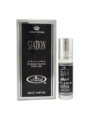 A 6ml bottle of Crown Perfumes Al-Rehab Station concentrated perfume oil by Crown Perfumes is shown beside its black and silver box.