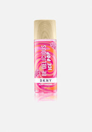 A 250ml DKNY Ice Pops Body Mist Very Cherry, a floral fruity scent, featuring a pink and orange swirled label and wooden-look cap.