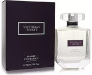 A 100ml bottle of Victoria's Secret Basic Instinct EDP is shown next to its sleek black and silver box.