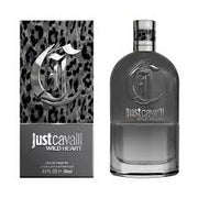 A 90ml bottle of Roberto Cavali’s Just Cavalli Wild Heart For Him Eau de Toilette is displayed beside its coordinating patterned box, both adorned with striking metallic lettering that emphasizes this woody aromatic men’s fragrance from the designer collection.