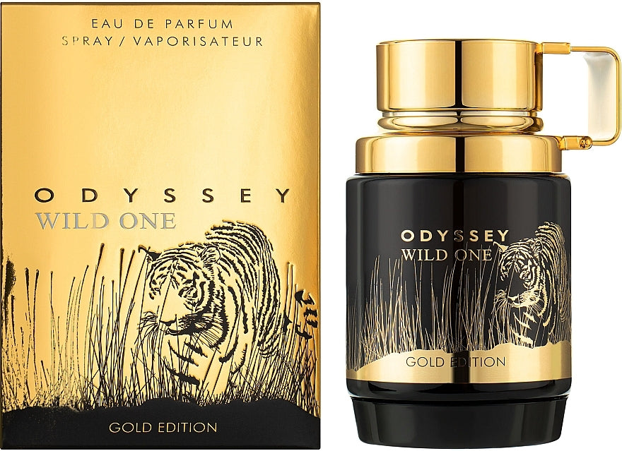 A black and gold bottle of Armaf Odyssey Wild One 100ml Eau De Parfum stands beside its matching box, both adorned with a tiger and grass design—a bold men’s fragrance by Armaf.