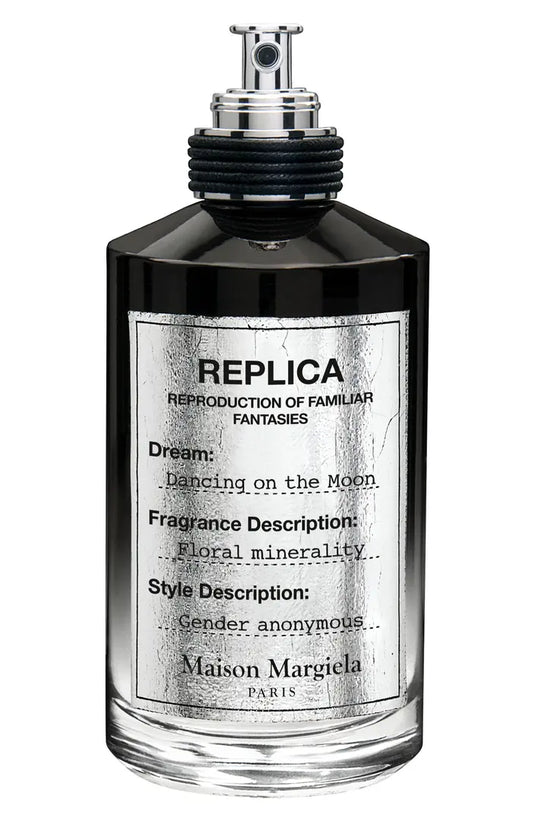 A bottle of Maison Martin Margiela Replica Dancing On The Moon fragrance on a white background.