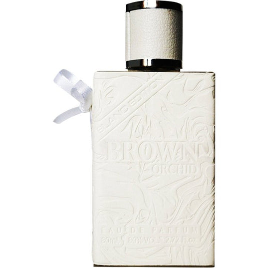 A white Fragrance World Brown Orchid Blanc Edition 80ml Eau De Parfum bottle with a bow on it.