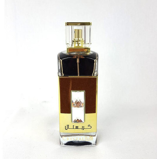 A women's perfume with floral-woody fragrance from Ard Al Zaafaran Crystal White 100ml Eau De Parfum, featuring Arabic writing.