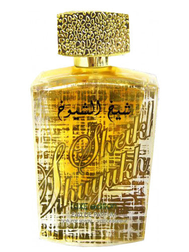 A golden bottle of Lattafa Sheikh Al Shuyukh Luxe Edition with Arabic writing.
