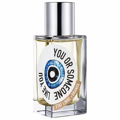 A women's fragrance with a ETAT Libre d'Orange You or Someone Like You 100ml eye on the bottle.