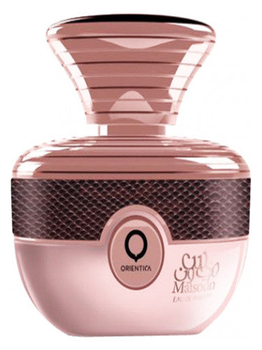 An Orientica Maisoon 100ml Eau De Parfum bottle in pink with a fruity fragrance and sleek black lid.