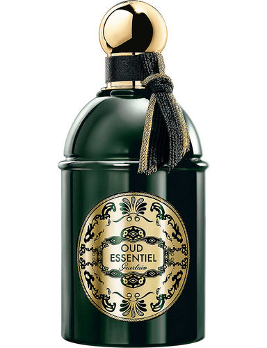 A bottle of Guerlain Oud Essentiel 125ml EDP fragrance with gold trim.