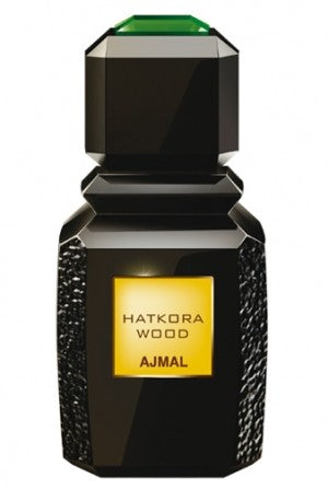 A bottle of Ajmal Hatkora Wood 100ml Eau De Parfum by Ajmal on a white background, available at Rio Perfumes.