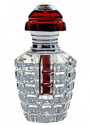 A Rio Perfumes bottle with a red lid.