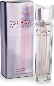 The Escada Sentiment Ladies 75ml Eau de Toilette, a delightful women's fragrance, comes in a transparent pink-hued bottle. Its reflective box elegantly showcases the Escada brand and "Eau de Toilette.