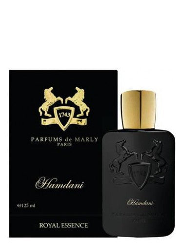 A box with a bottle of Parfums De Marly Hamdani perfume and a box of cologne.