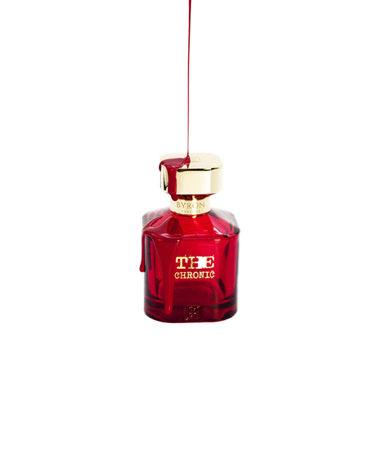 A bottle of Byron Parfums' Parfums The Chronic 75ml Extrait De Parfum hanging from a string.