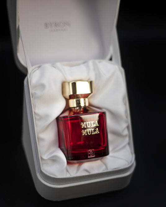 A bottle of Byron Parfums Mula Mula Rouge Extreme Collection 75ml Extrait De Parfum by Byron Parfums in a white box.