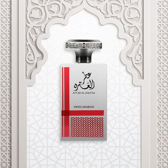 Load image into Gallery viewer, A bottle of Swiss Arabian Attar Al Ghutra 100ml Eau De Parfum ATTAR GHUTRA perfume with arabic calligraphy on a white background.
