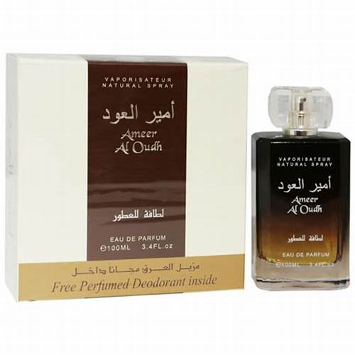 The Lattafa Ameer Al Oud 100ml Eau de Parfum by Dubai Perfumes features an elegant perfume box, a "Vaporisateur Natural Spray," and includes a free perfumed deodorant inside. Suitable for men and women, it offers an alluring scent experience.