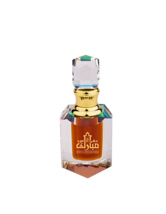 A glass perfume bottle with a gold lid containing Swiss Arabian Dehn El Oud Mubarak, a concentrated perfume oil, suitable for both men and women.