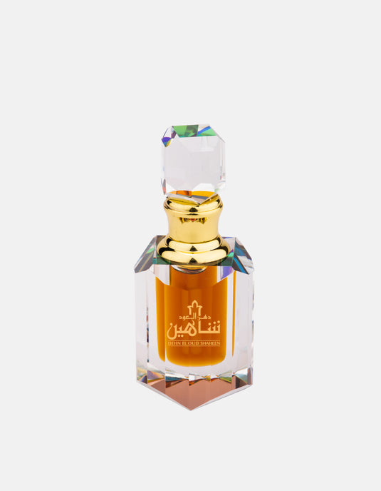 A Swiss Arabian Dehn El Oud Shaheen 6ml perfume bottle, fragrance for men and women, on a white background.