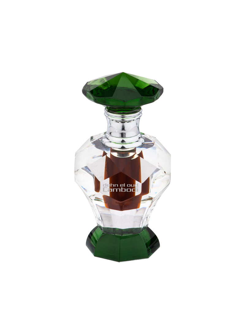 Load image into Gallery viewer, A bottle of Swiss Arabian Dehn El Oud Cambodi concentrated perfume oil 3ml with a glass top.
