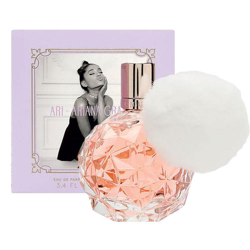 The Ariana Grande 100ml Eau De Parfum, a fragrance for women, is elegantly presented in a bottle adorned with a cozy fluffy pom pom.
