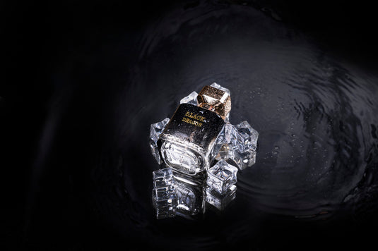A bottle of Byron Parfums Black Dragon 75ml Extrait De Parfum sitting on top of a black background.