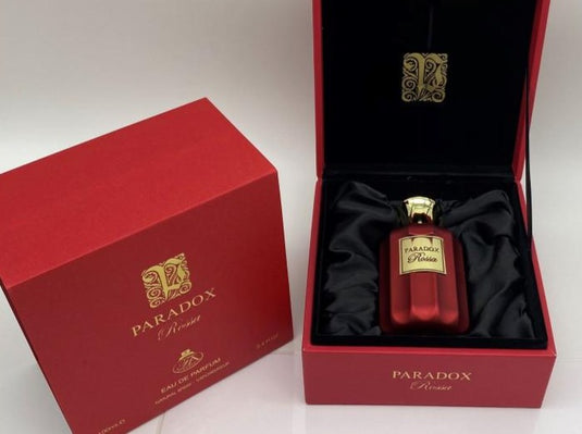 A bottle of Paris Corner Fragrance Avenue Paradox Rossa 100ml Eau De Parfum in a red box by Dubai Perfumes.