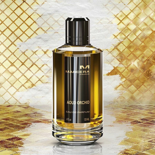 A 120ml bottle of Mancera Aoud Orchid 120ml Eau De Parfum by Mancera, elegantly displayed on a gold tiled background.