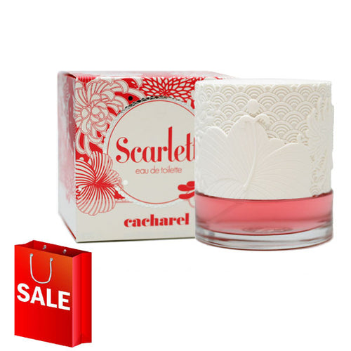 A bottle of Cacharel Scarlett perfume with a shopping bag from Rio Perfumes.