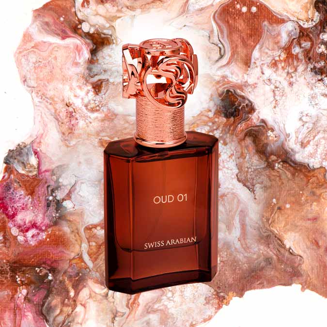 Load image into Gallery viewer, A bottle of Swiss Arabian Oud 01 50ml Eau De Parfum sitting on top of a colorful background.

