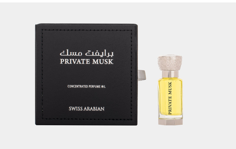 Load image into Gallery viewer, A bottle of Swiss Arabian Private Musk 12ml Concentrated Perfume Oil with a Guess box next to it.
