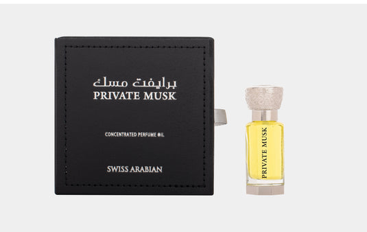 A bottle of Swiss Arabian Private Musk 12ml Concentrated Perfume Oil with a Guess box next to it.