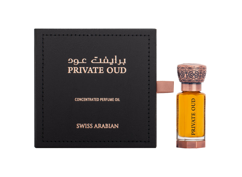 Load image into Gallery viewer, A bottle of Swiss Arabian Private Oud 12ml Concentrated Perfume Oil with a box containing concentrated perfume oil.
