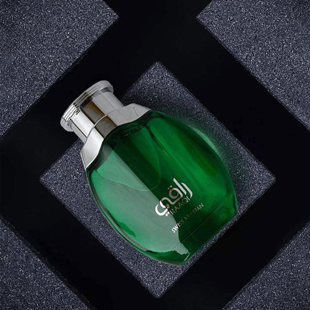 A bottle of Swiss Arabian Raaqi 100ml Eau De Parfum, perfect for both men and women, displayed elegantly against a sleek black background.