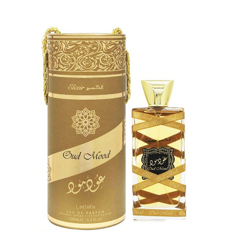 Load image into Gallery viewer, A bottle of lattafa Oud Mood Elixir 100ml Eau De Parfum perfume, accompanied by a box displaying the captivating fragrance of oud.
