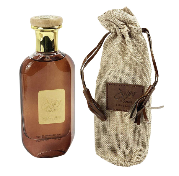 Load image into Gallery viewer, A bottle of Ard Al Zaafaran Mousuf 100ml Eau De Parfum with a brown bag next to it.
