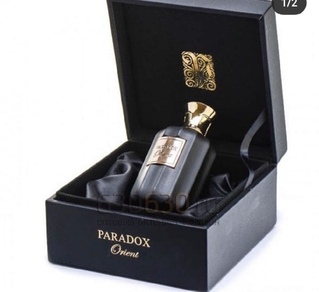 Load image into Gallery viewer, A black box containing a Paris Corner Paradox Orient 100ml Eau De Parfum for both men and women.
