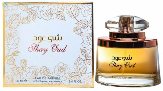 A bottle of Ard Al Zaafaran Shay Oud 100ml Eau de Parfum by Dubai Perfumes with a box next to it.