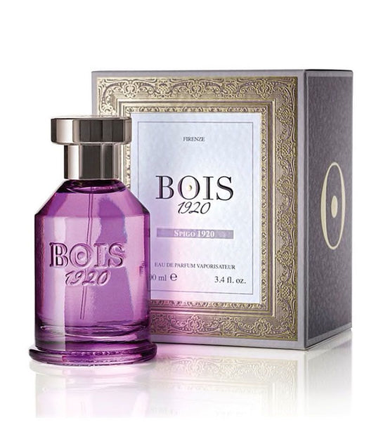 A fragrance bottle of Bois 1920 Spigo 100ml Eau De Parfum in front of a box.