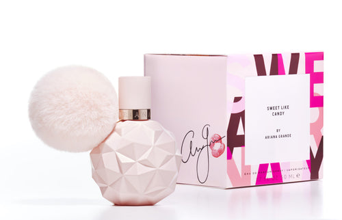 An Ariana Grande Sweet Like Candy 100ml Eau De Parfum, delicately scented for women, housed in a bottle adorned with a fluffy pom pom.