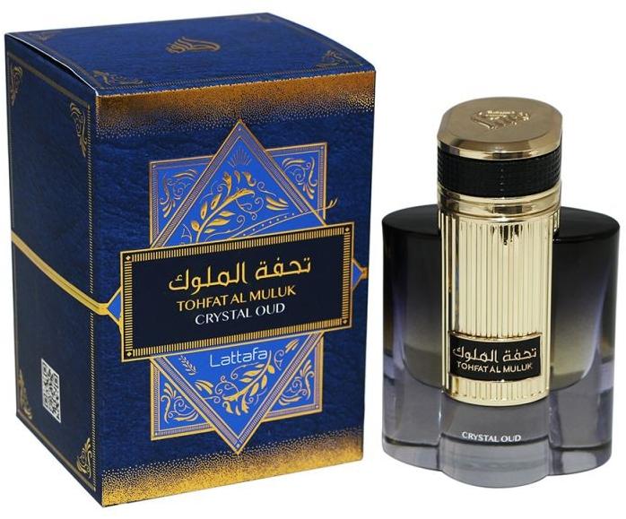 Load image into Gallery viewer, A bottle of Lattafa Tohfat Al Muluk Crystal Oud 100ml Eau de Parfum by Lattafa next to a box.
