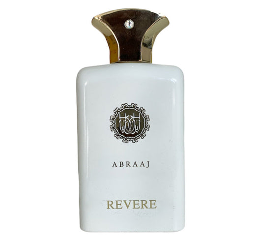 An enticing bottle of Paris Corner Abraaj Revere 100ml Eau de Parfum, designed to captivate both men and women, showcased elegantly on a pristine white background.