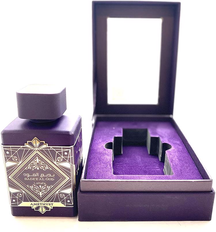 Load image into Gallery viewer, A bottle of Lattafa Badee Al Oud Amethyst 100ml Eau De Parfum in a purple box.
