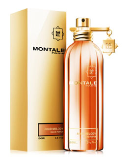 A bottle of Montale Paris Aoud Melody perfume in front of a box.