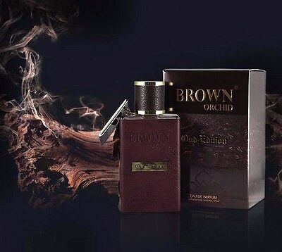 A Fragrance World Brown Orchid Oud Edition 80ml Eau De Parfum bottle next to a box of smoke.